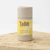 Tallo zinc stick on a wooden surface with a white background