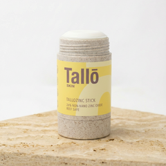 Tallo zinc stick on a wooden surface with a white background